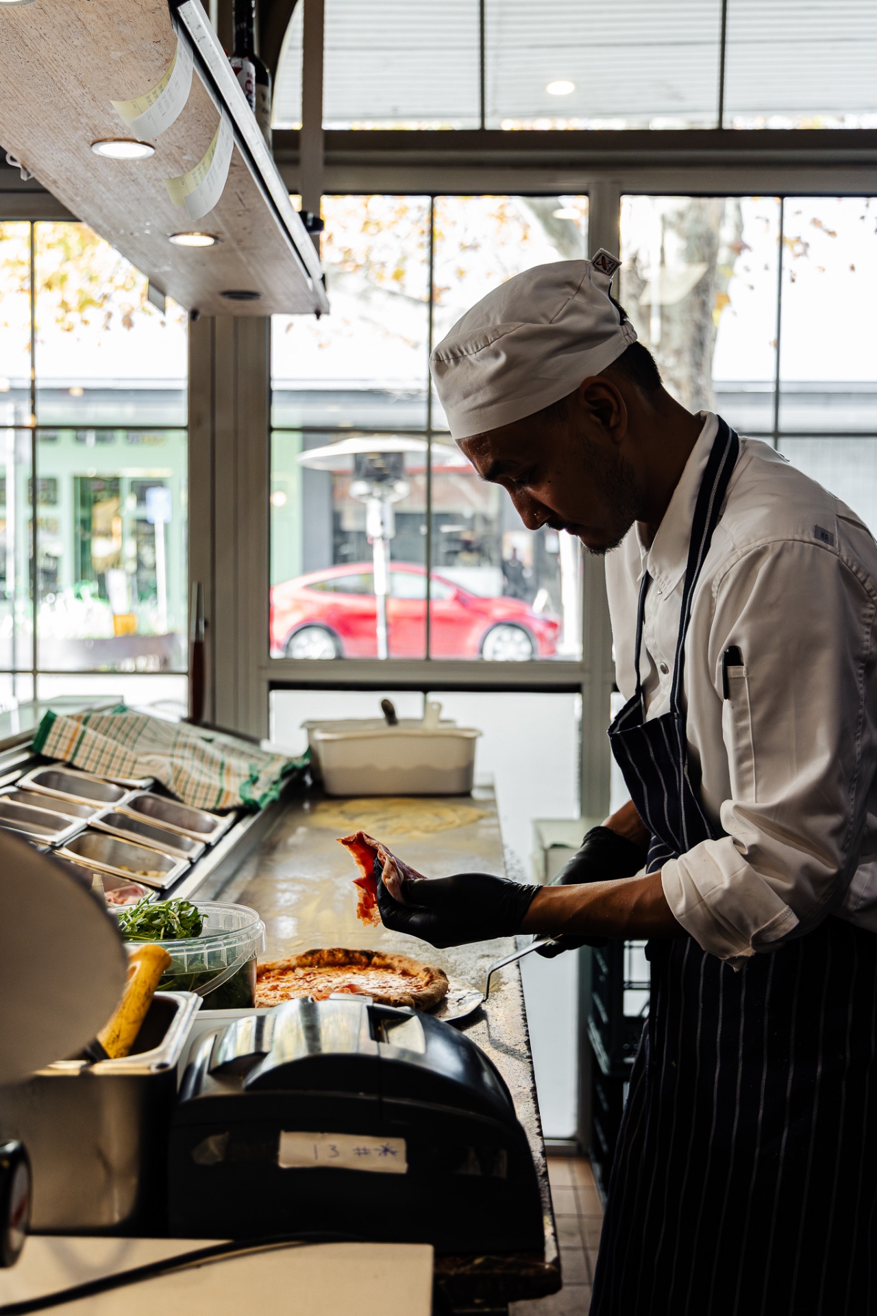A Via Dolce pastry chef finishing a dessert by hand